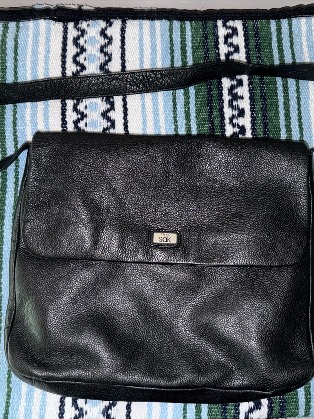 The Sak Black Pebbled Leather Messenger Bag with Logo Plaque